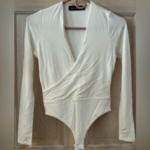 Naked Wardrobe Wrap Long Sleeve Bodysuit in Ivory. Women’s Medium